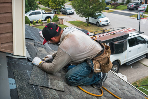 Professional Roofing technician working in Ocean Beach, NY
